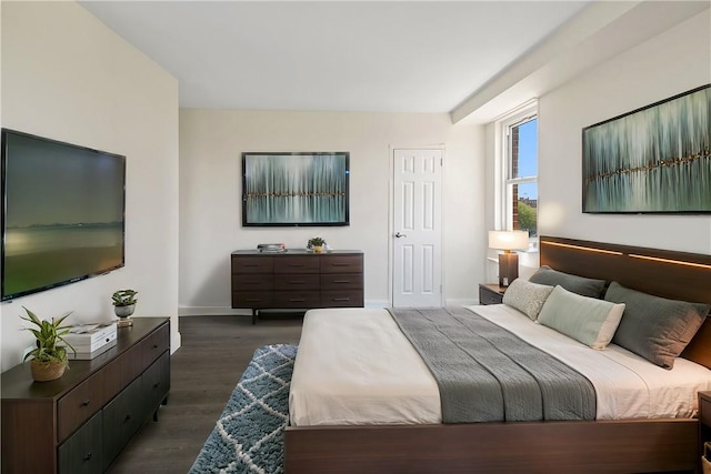 bedroom featuring dark wood-type flooring