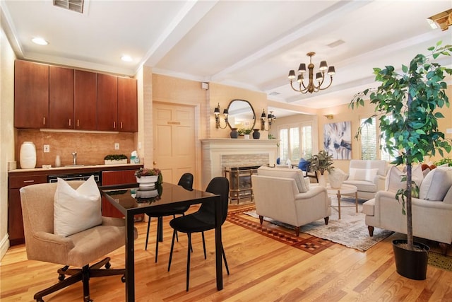 interior space with beam ceiling, light hardwood / wood-style floors, and a notable chandelier