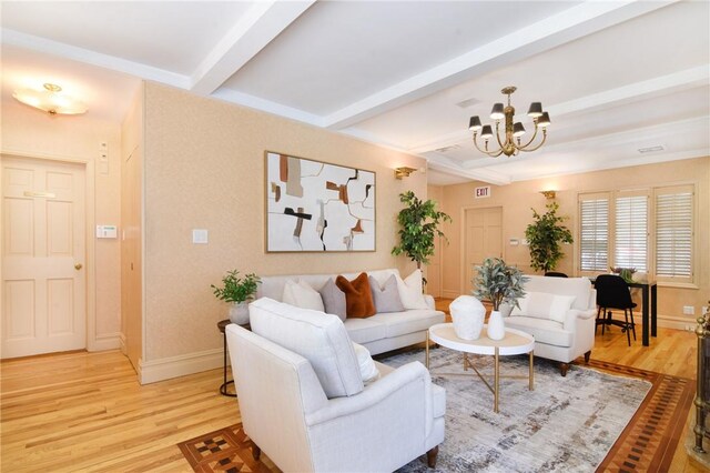 living room featuring beamed ceiling, wood-type flooring, and a chandelier