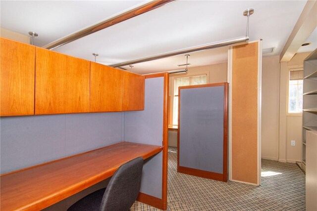 kitchen featuring light carpet