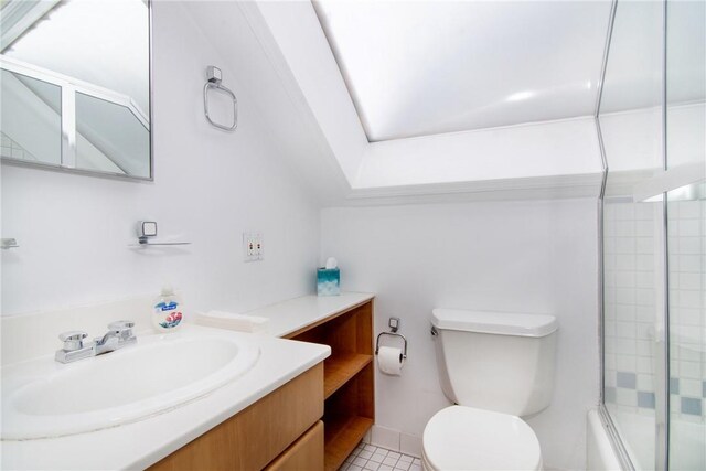 full bathroom featuring shower / bath combination with glass door, tile patterned flooring, vanity, and toilet