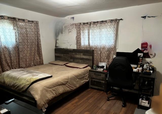 bedroom featuring dark wood-type flooring