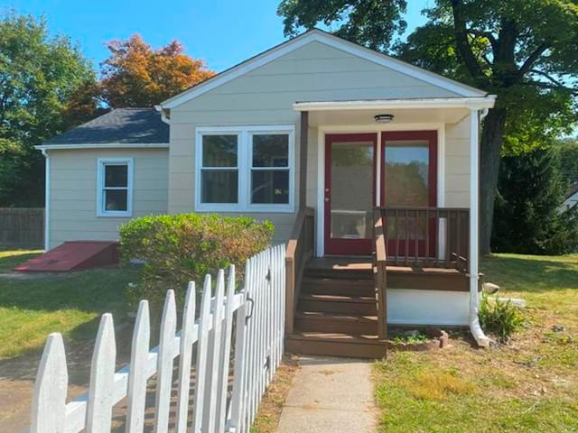 bungalow with a front lawn