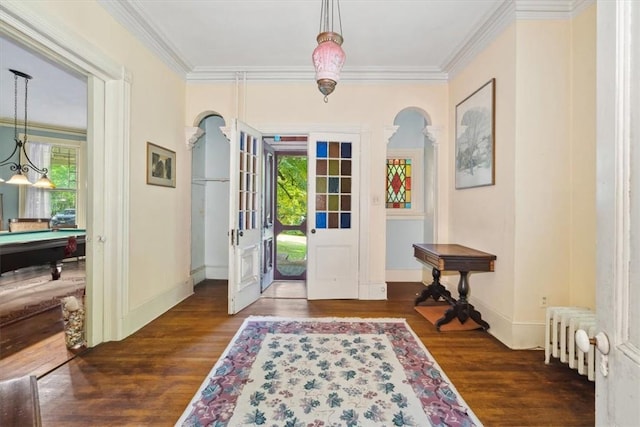 entryway with dark wood-type flooring, pool table, crown molding, and radiator