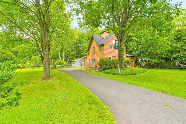 view of home's exterior featuring a yard