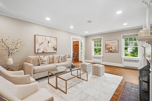 105 Walworth Ave, Scarsdale, NY 10583 - living area featuring radiator, crown molding, baseboards, wood finished floors, and recessed lighting