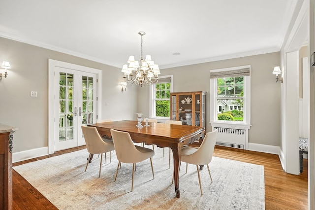 105 Walworth Ave, Scarsdale, NY 10583 - dining room featuring radiator heating unit, french doors, baseboards, ornamental molding, and a chandelier