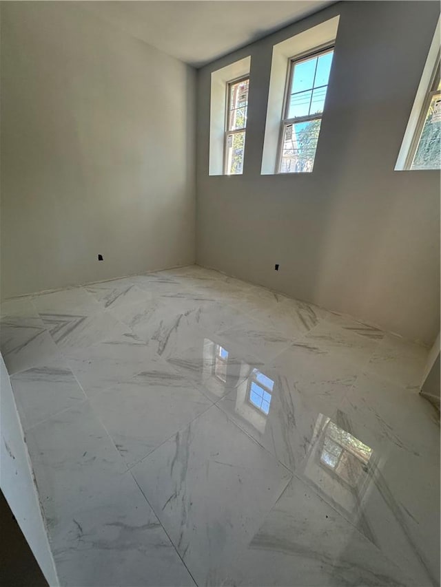 bathroom featuring a skylight and plenty of natural light