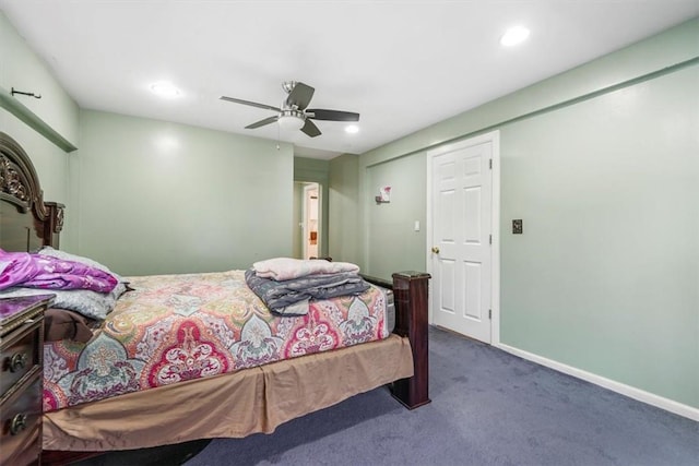 bedroom with dark colored carpet, ceiling fan, and a closet