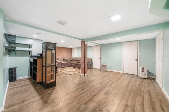 basement featuring light wood-type flooring