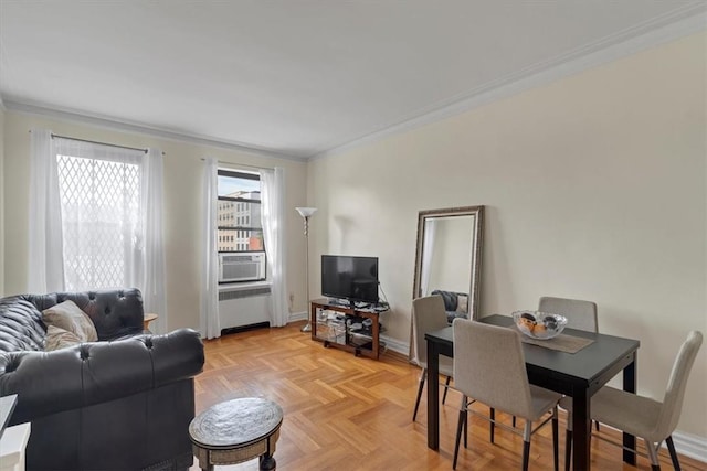 living room featuring light parquet flooring, cooling unit, radiator, and ornamental molding