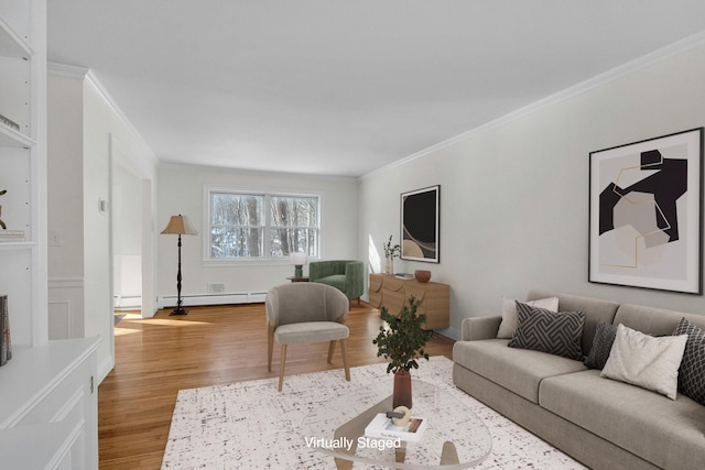 living room with crown molding, a baseboard heating unit, and hardwood / wood-style flooring