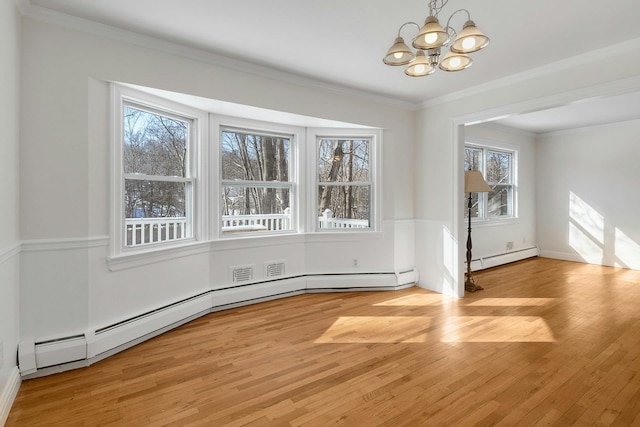 unfurnished dining area with a notable chandelier, ornamental molding, light hardwood / wood-style floors, and a baseboard heating unit