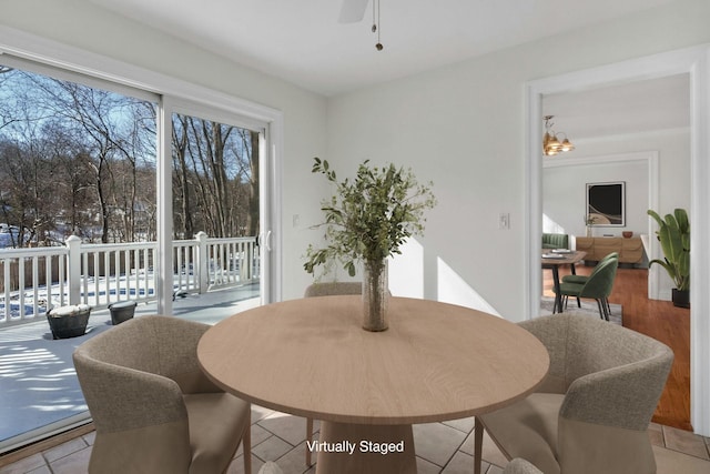 dining space featuring ceiling fan