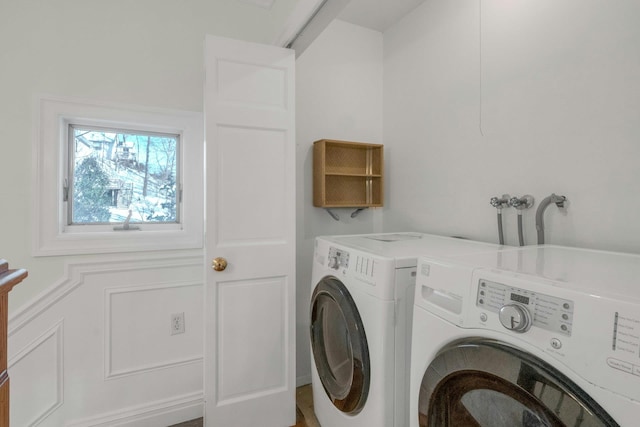 clothes washing area with washer and dryer