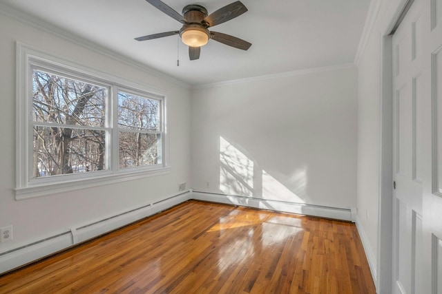 interior space with a baseboard heating unit, wood-type flooring, and ornamental molding