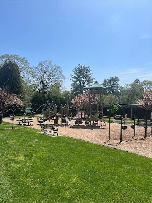 view of community with a playground and a lawn