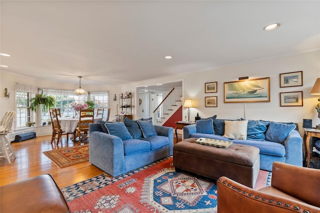 living room featuring hardwood / wood-style floors and ornamental molding