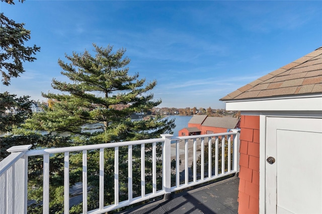 balcony featuring a water view