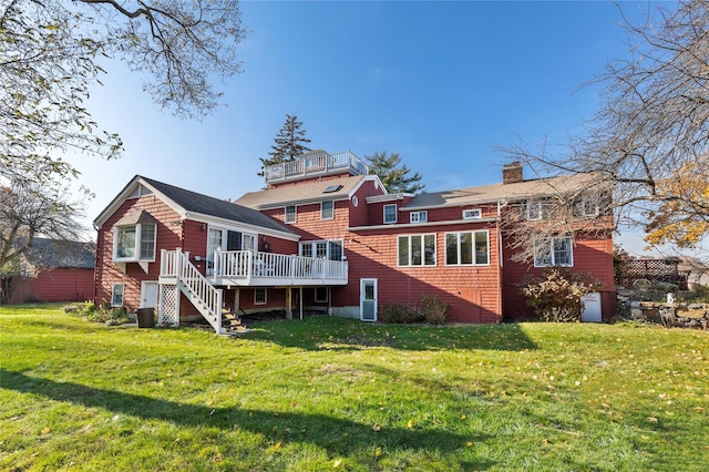 back of house featuring a wooden deck, central AC, and a lawn