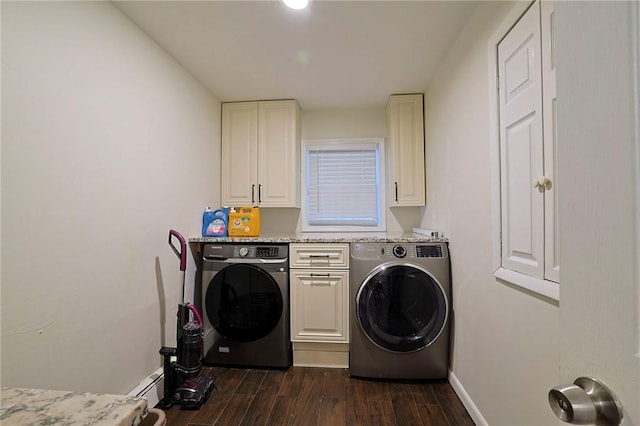 laundry area featuring cabinets, dark hardwood / wood-style flooring, separate washer and dryer, and a baseboard heating unit