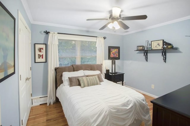 bedroom featuring a closet, ceiling fan, hardwood / wood-style floors, and ornamental molding