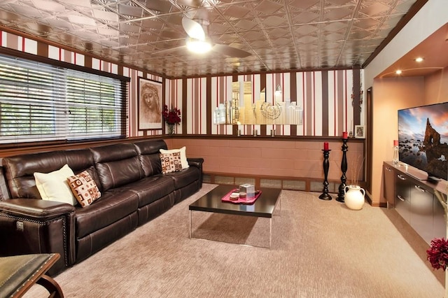 living room featuring carpet floors and ceiling fan