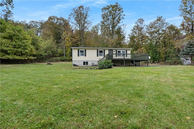 view of front of home featuring a deck and a front lawn