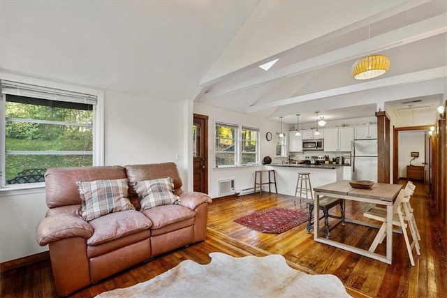 living room with hardwood / wood-style floors and lofted ceiling with beams