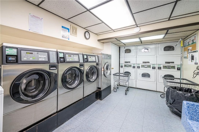 clothes washing area featuring separate washer and dryer and stacked washer and clothes dryer