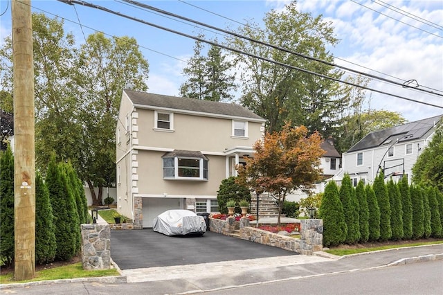 front of property featuring a garage