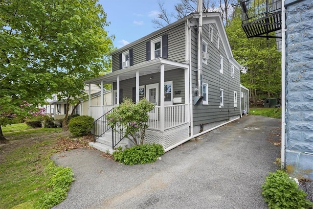 view of home's exterior with a porch