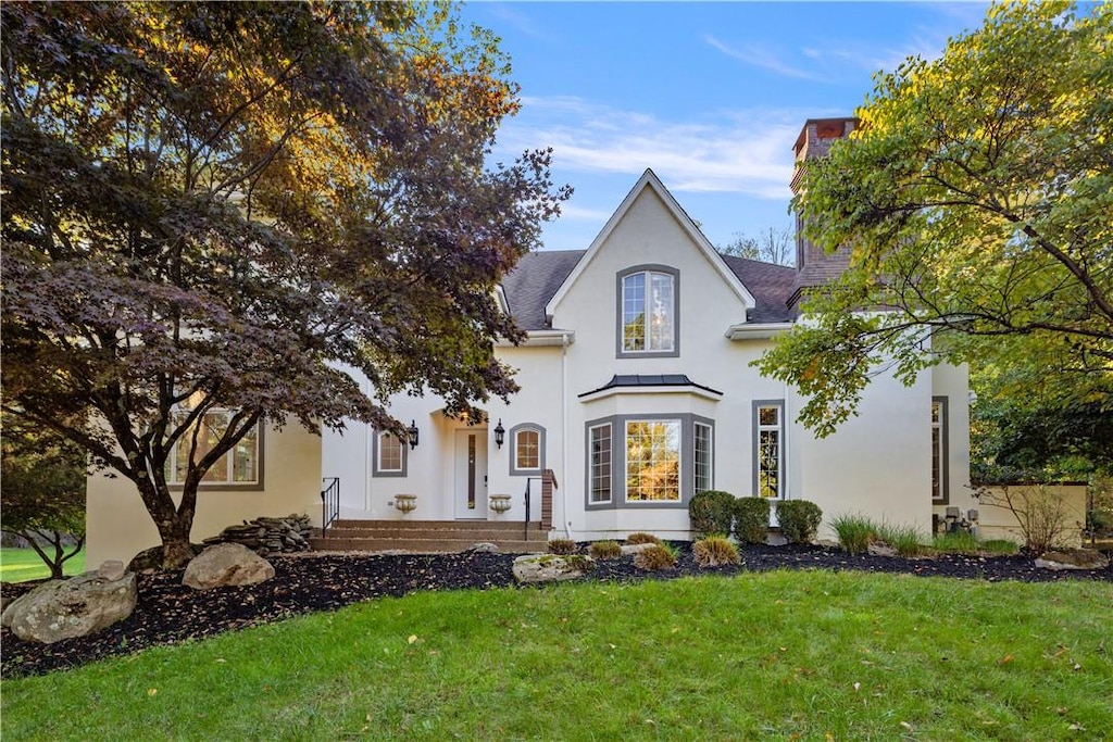 view of front of home with a front yard