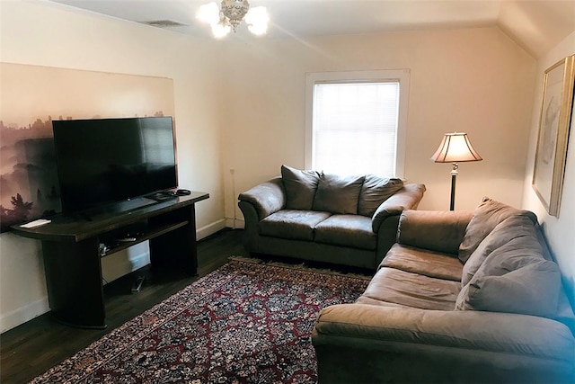 living room featuring dark hardwood / wood-style floors, ceiling fan, and lofted ceiling