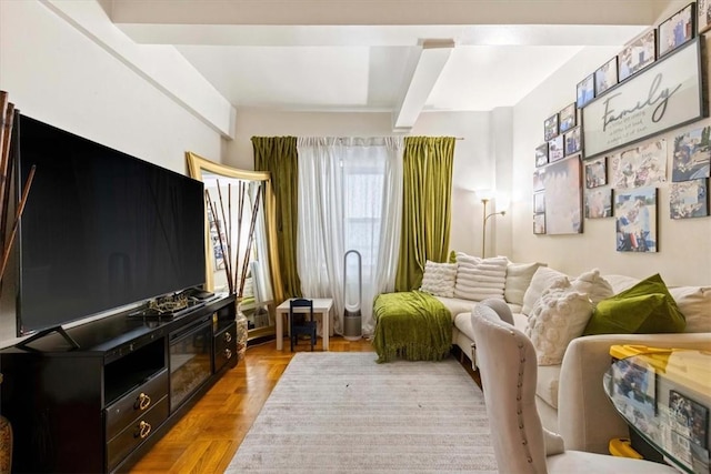 living area featuring beam ceiling and light parquet flooring