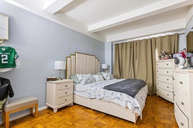 bedroom with light parquet flooring