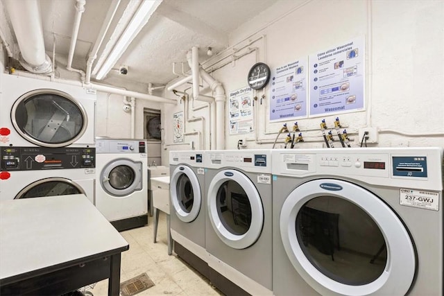 laundry room with washer and dryer and stacked washer / dryer