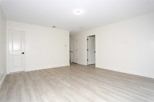 unfurnished room featuring light hardwood / wood-style flooring