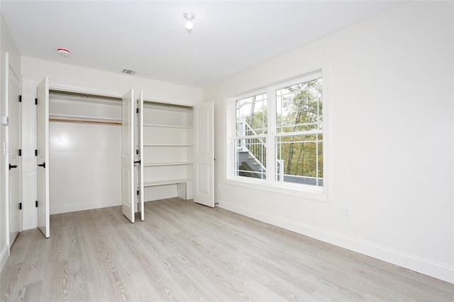 unfurnished bedroom with light hardwood / wood-style flooring