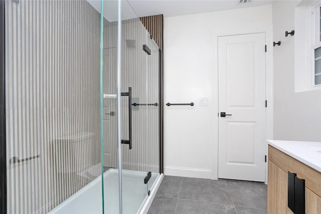 bathroom featuring tile patterned flooring and vanity