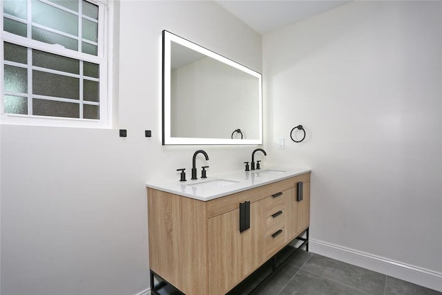 bathroom featuring tile patterned flooring and vanity