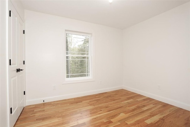 unfurnished room with light wood-type flooring