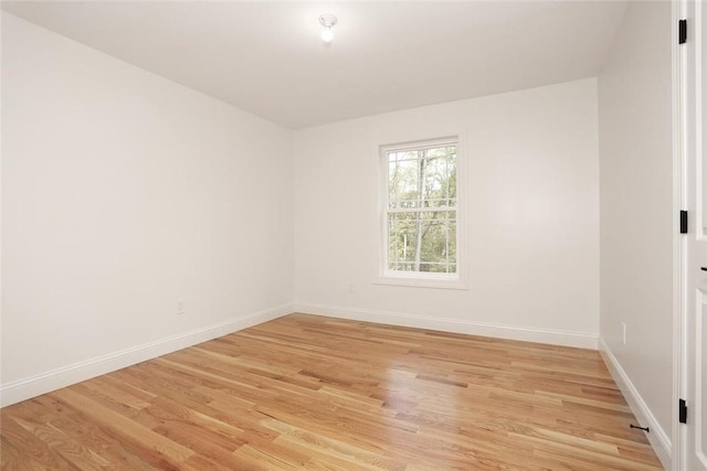 unfurnished room with light hardwood / wood-style floors