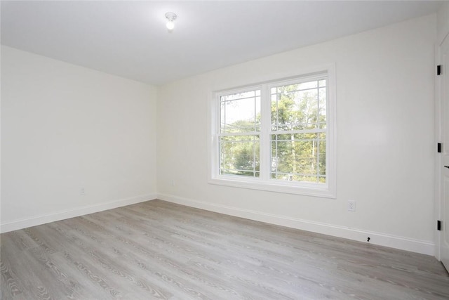 unfurnished room featuring light hardwood / wood-style flooring