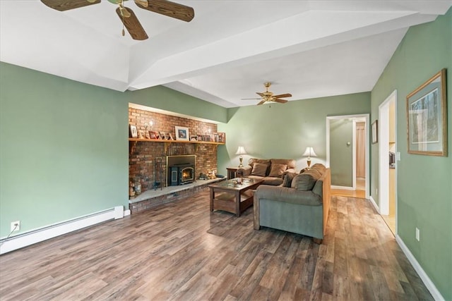 living room featuring a wood stove, baseboard heating, dark wood-type flooring, and ceiling fan