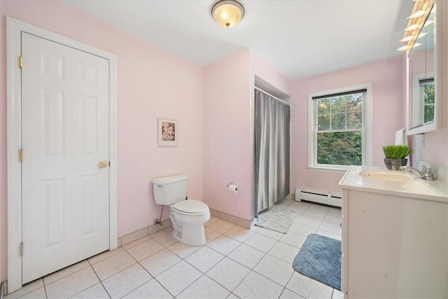 bathroom featuring baseboard heating, tile patterned floors, vanity, and toilet