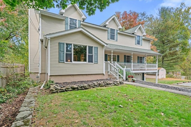 view of front of house with covered porch and a front yard