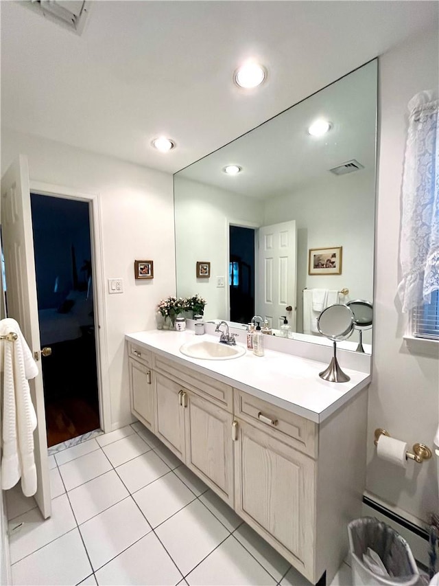 bathroom with tile patterned flooring and vanity