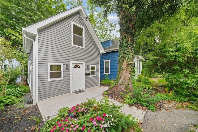 rear view of property featuring a patio area