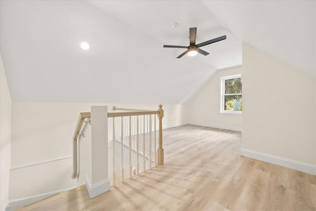 additional living space with ceiling fan, light hardwood / wood-style floors, and lofted ceiling